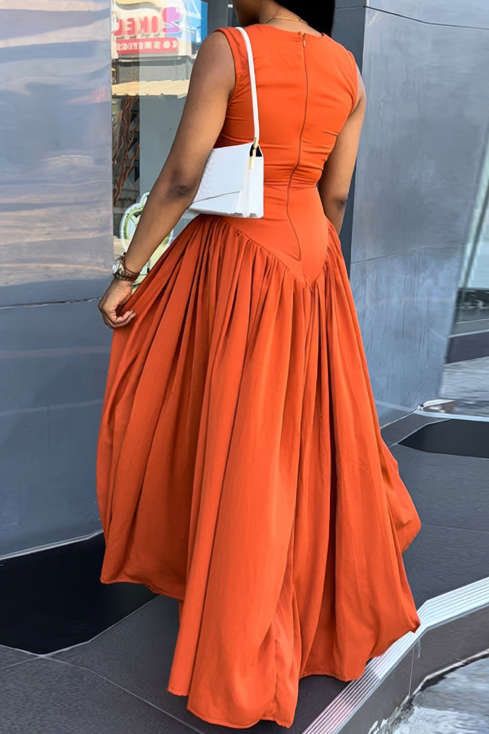 Sleeveless Cut-Out Maxi Dress with Flowing Skirt