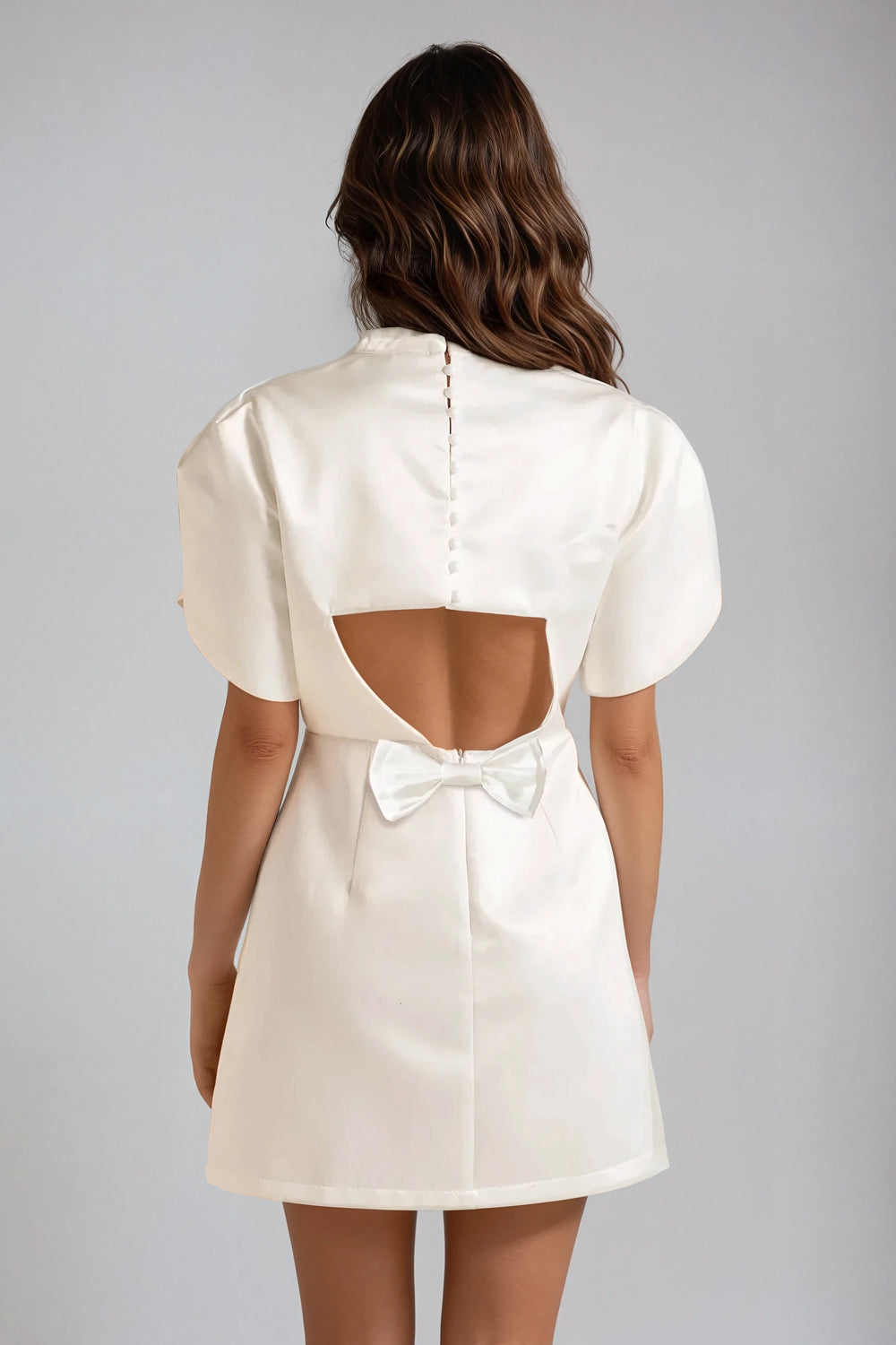 Mini Dress with Structured Sleeves and Open-Back Bow Detail - White