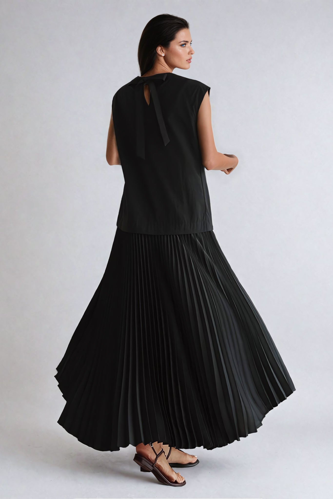 Sleeveless Maxi Dress with Pleated Skirt and Bow Accent - Black